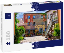 Lais Puzzle - Farbenfrohes Leben, Innenhof Neuruppin - 100 Teile