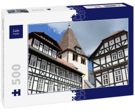 Lais Puzzle - Turm der Stiftskirche mit Fachwerkhäusern in Kaufungen / Hessen - 500 Teile