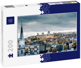 Lais Puzzle - Turm der Kirche "Notre-Dame des Récollets" und Stadtbild von Verviers mit einem dramatischen Himmel - 200 Teile